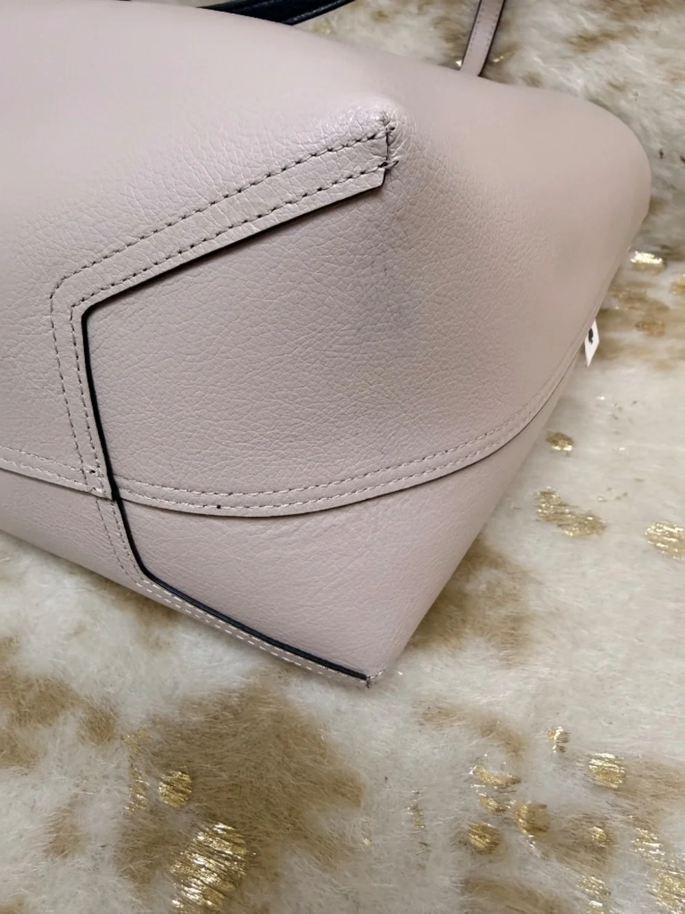 Stylish Kate Spade reversible tote in classic black with blush pink interior